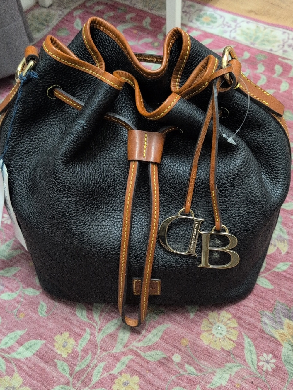 Dooney & Bourke Black Pebble Leather Drawstring Bucket Bag with Tan Trim